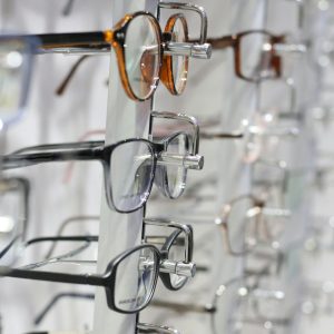 silver framed eyeglasses on clear glass